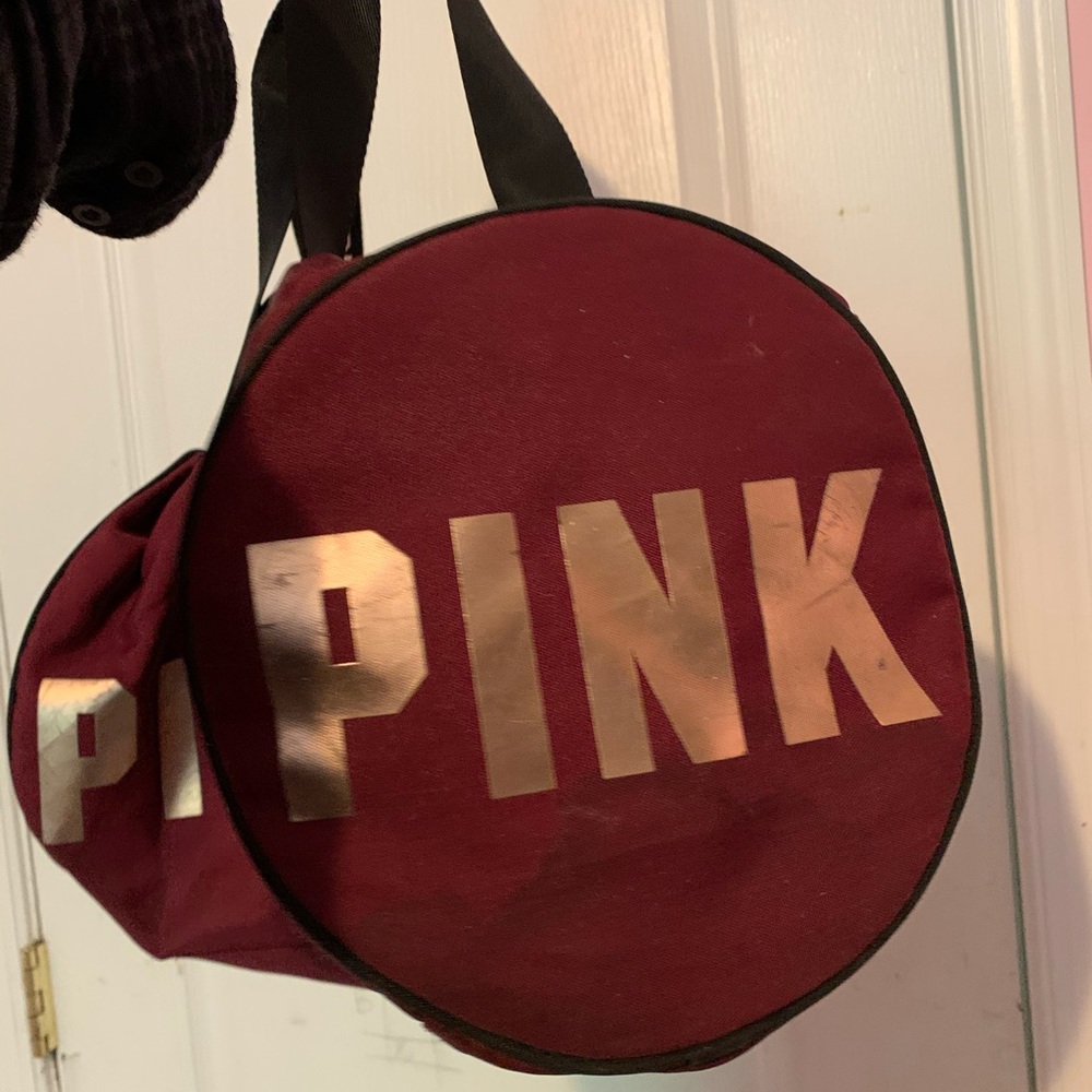 medium burgundy VS pink duffel bag